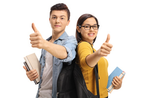 Teenage students with backpacks and books making thumb up gestures